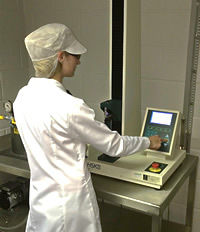 Staff member in quality control department, testing a custom molding